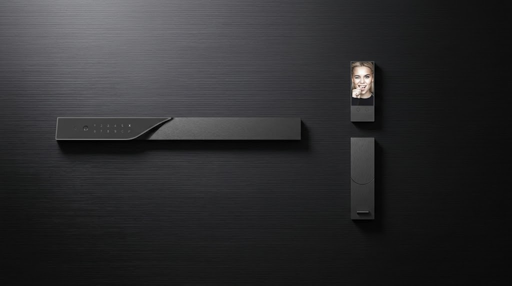 Interior view of KMAN-LX smart lock featuring a split design: 5-inch HD video intercom screen on top and a rapid-escape handle with one-touch auto-open button below.